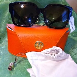 Tory Burch sunglasses, case, and drawstring bag.